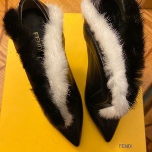 Fur accented black leather boot with geometric heel